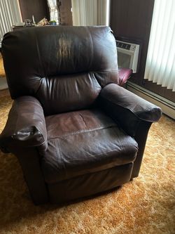 Broken faux leather recliner