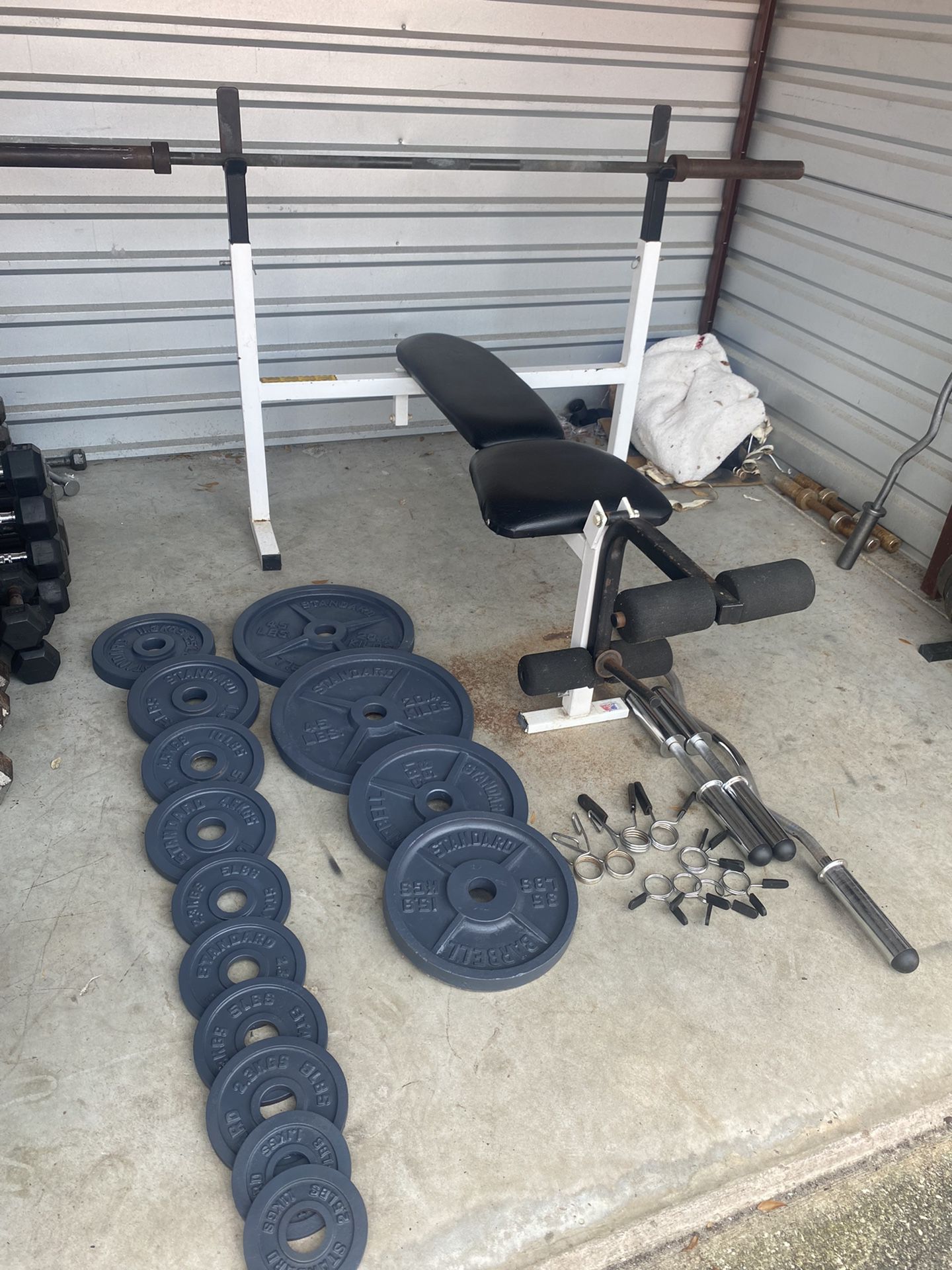 Bench And Rack With 255lbs Of Plates + Bars And Clips 