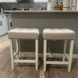 2 tufted counter stools
