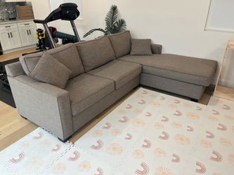 Large grey sectional couch