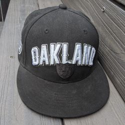 Black and silver NFL Oakland Raiders hat