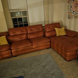 Orange Sofa Set And A Grey Chair