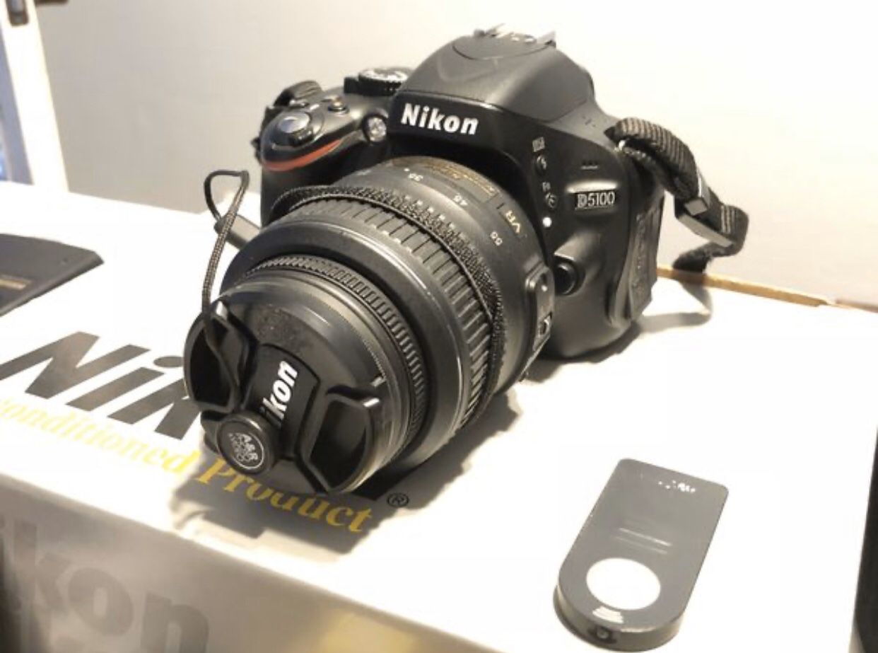 Nikon D5100 + 18-55mm lens + Battery Grip + flash + extras