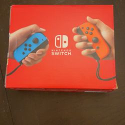 Nintendo Switch With Blue And Red Controllers