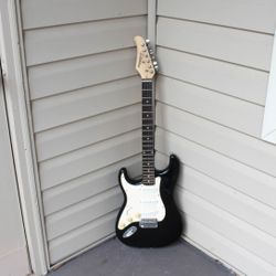 Used Silvertone Left-Handed Electric Guitar – Black & White with Golden Oak Neck, Great for Classic Rock, Used Good Condition