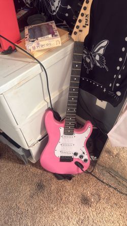 Pink electric guitar