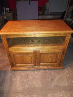 T.V. STAND WITH STORAGE ON WHEELS