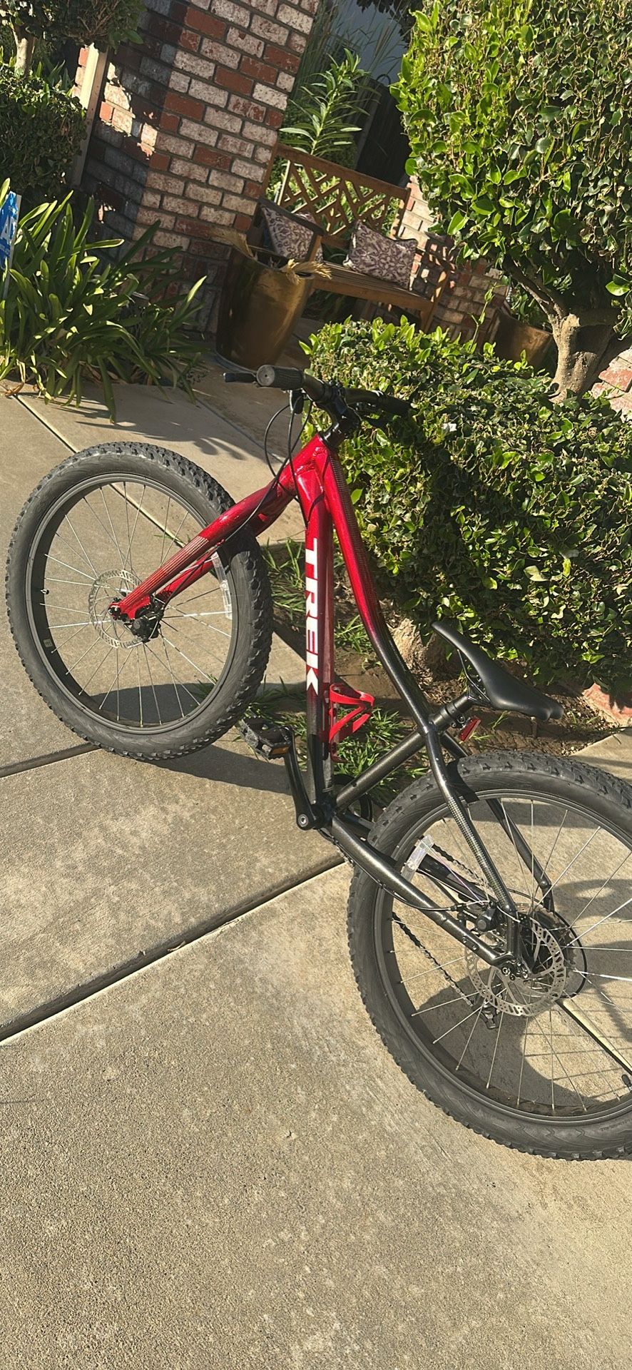 Trek Red Bike With Helmet