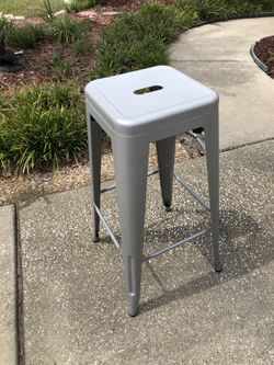 Grey metal stool