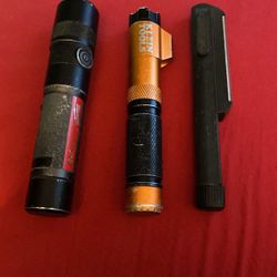 Milwaukee Flashlight And Klein Tool Flashlight With Red Dot In Another Flashlight