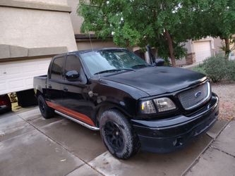 '01 Ford F-150 black 4Door