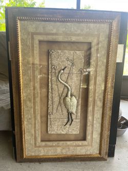 Framed sculpture of a crane