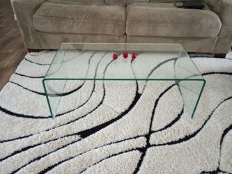 Waterfall style glass coffee table