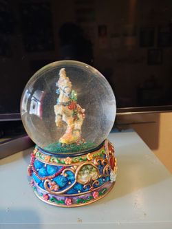Ornate carousel horse snow globe