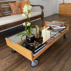 For Sale: Pre-owned Italian Coffee Table with Wheels and Built-in Metal Tray.