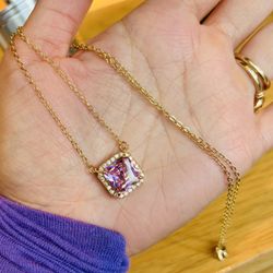 Brand New Fancy Gold Tone Necklace featuring a Pink Asscher Cut Zircon Stone.