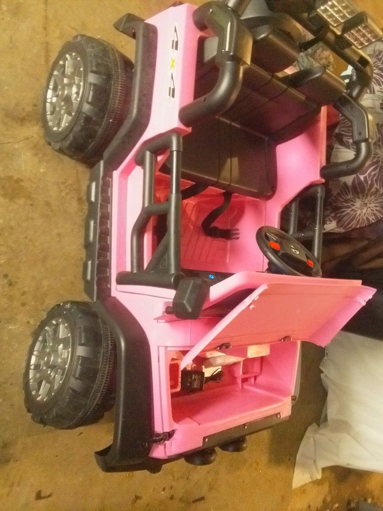 Kids Jeep. Color pink. Has a Remote and Charger. Also has new Battery just bought. Everything works as it should. See pics and videos.