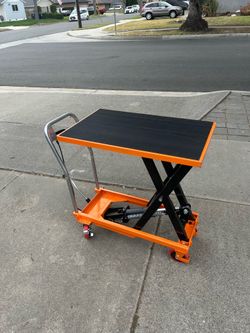 manual hydraulic lift table cart with a 1100 lbs capacity and a 35-inch lifting