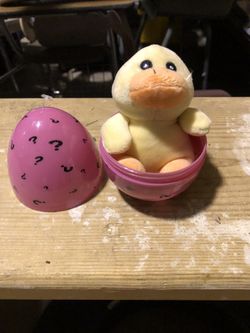 Easter egg with small stuffed animal.