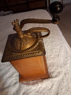 Antique box styled hand cranked coffee grinder