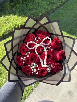 12 red rose bouquet with baby breaths