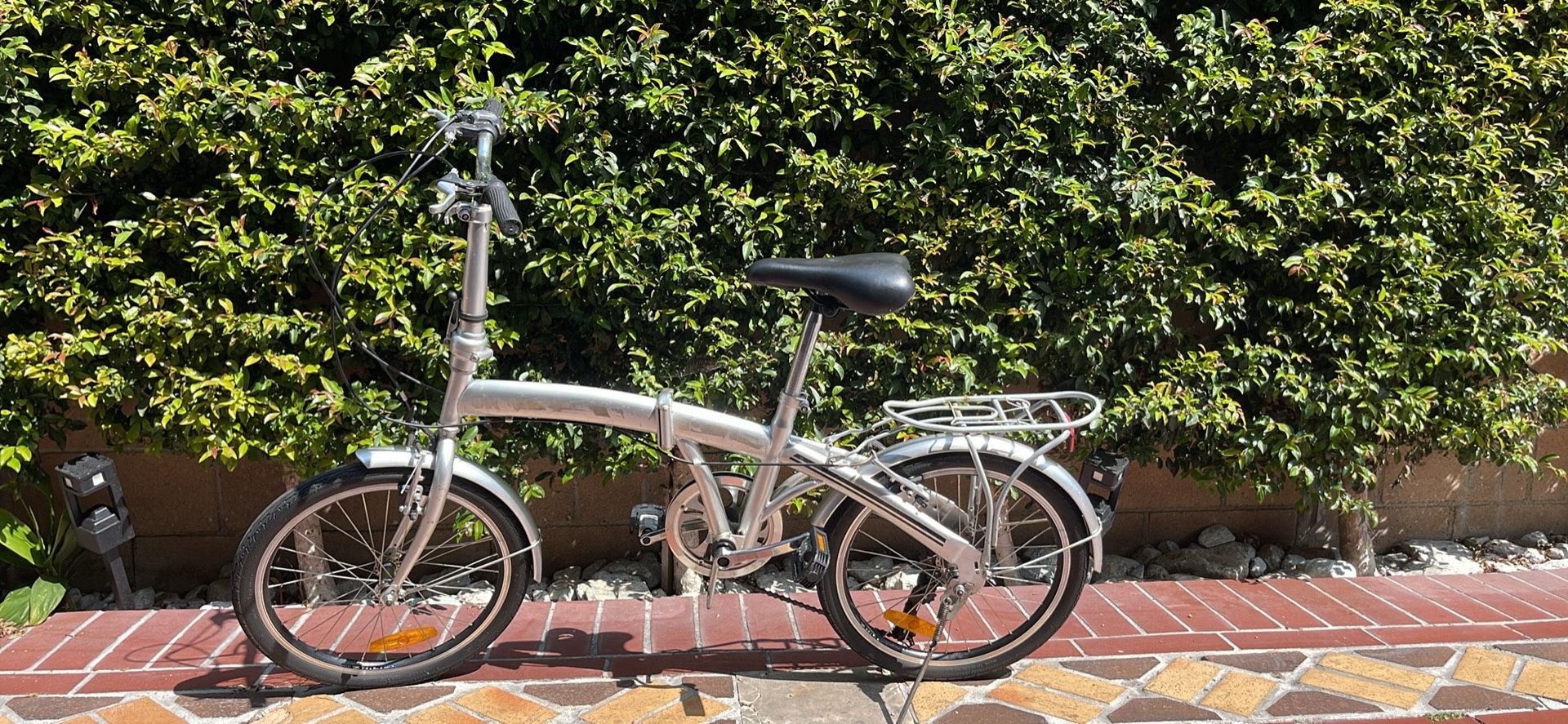 Chrome folding bike easy to transport or store.