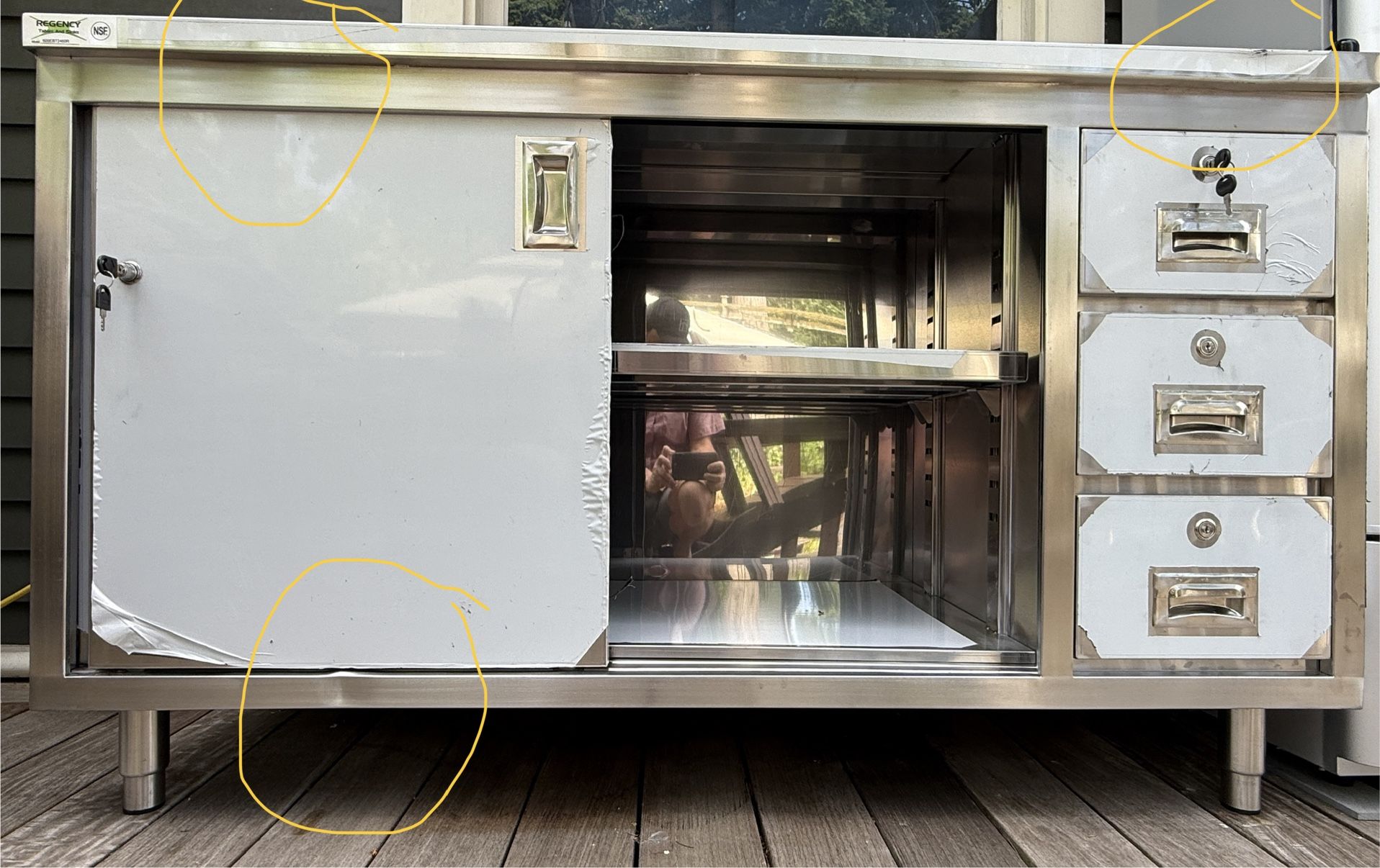 Regency 24" x 60" 16 Gauge Type 304 Stainless Steel Enclosed Base Sliding Door Table with Drawers
