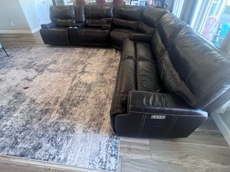 Sectional leather reclining sofa