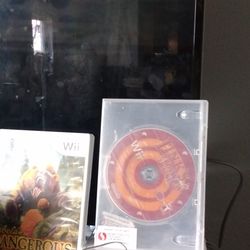 Nintendo Wii With Games One Controller And A Nunchuck