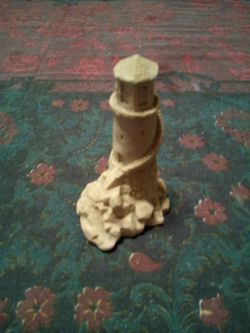 Lighthouse/a Mr. Sandman real sand sculpture /1994 investments LTD /made in canada