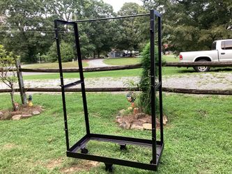 ROLLING  HEAVY DUTY RACK WITH HOOKS ON THE SIDES (72”TALL X  45 1/4”LONG X 23 1/4”. WIDE).