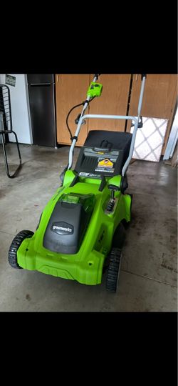 GreenWorks cordless Lawn mower and Weedeater with battery and charger