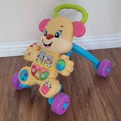 Practically New Baby Walker With Music And Lights ( Used Once). Price Firm!