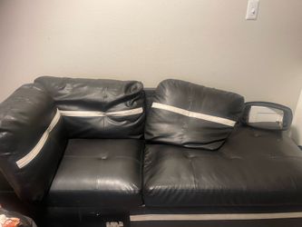 3 piece section leather black and white couch with ottoman