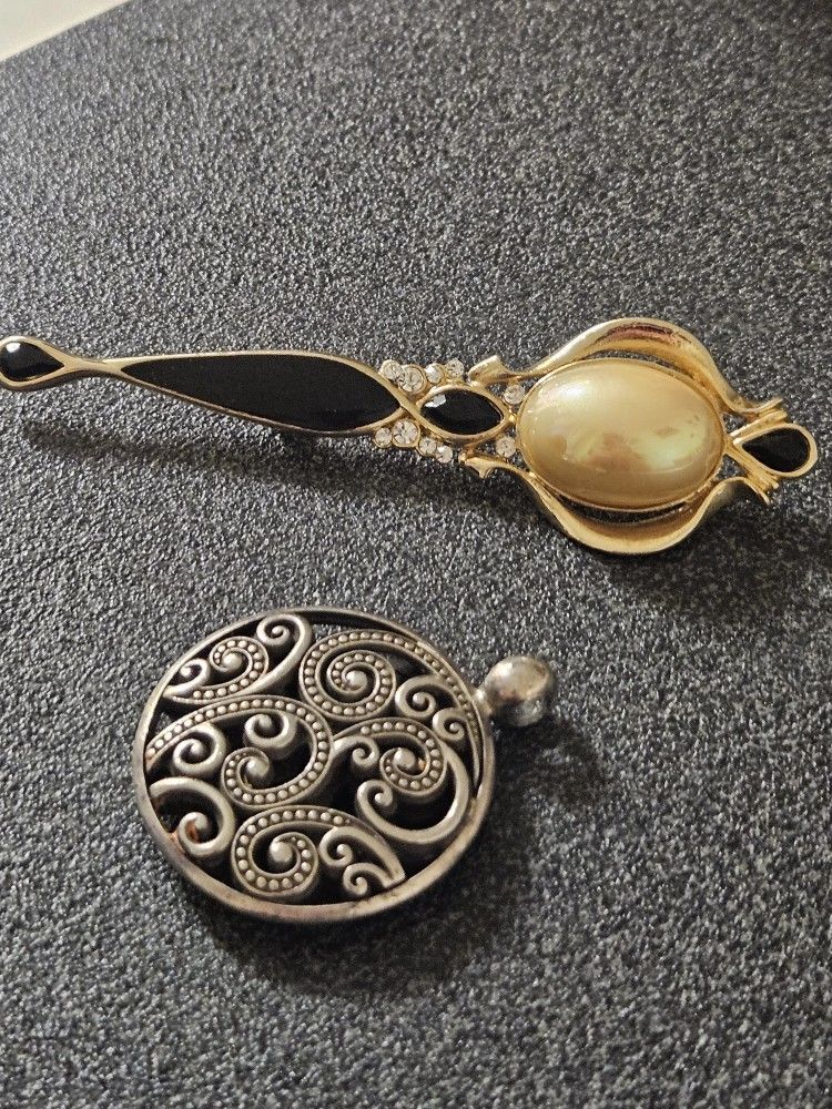 brooch and pendant.