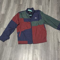 stussy  multi colored track jacket