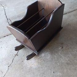 Cradle magazine rack.