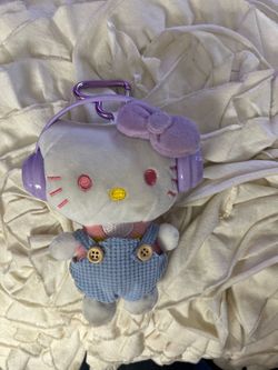 Hello Kitty plush doll keychain wearing overalls & purple bow and headphones