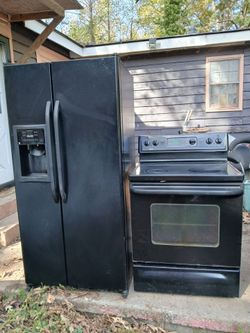Black Side-by-Side Refrigerator and Electric Range