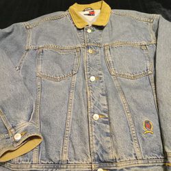 Vintage Tommy Hilfiger Denim Jacket, mens sz lg.,  has stitched logo on front with Tommy Jeans patch on waist & back top  & silver Tommy buttons.
