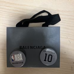Balenciaga xNBA buttons. 