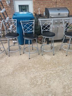 Five swivel bar chairs 23 inches high from the ground 15 round
