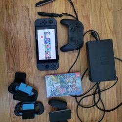 Nintendo Switch With Pro Controller And Super Smash Bros.