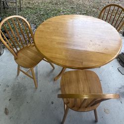 Small, wooden kitchen table with 3 chairs