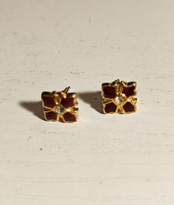 $25 Vintage four-petal red enamel stud.