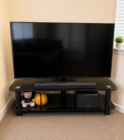Samsung 75” Flat Screen TV stand and sound bar included. “