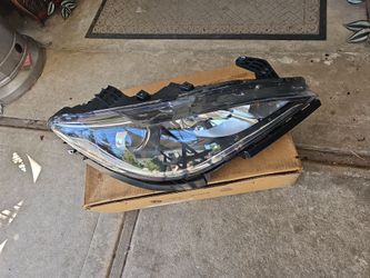 Headlamp, Front passenger side, $200,it has a broken bracket