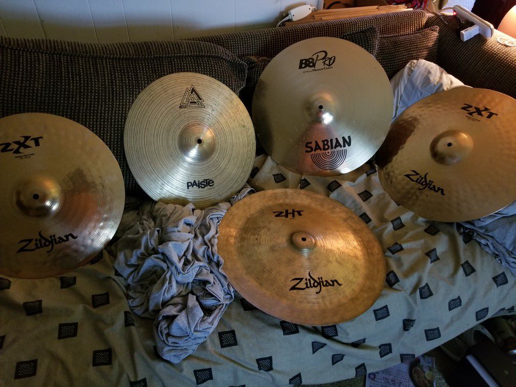 3 Ziljian cymbals 1sabian cymbal and 1paiste cymbal