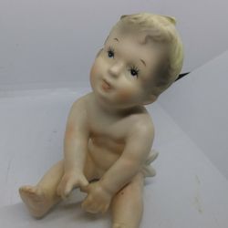 VINTAGE PORCELAIN PIANO BABY