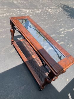 Table top is leather and glass